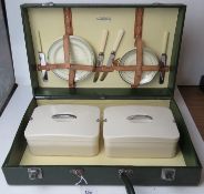 A vintage Sirram picnic basket having or