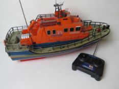 A RNLI Lifeboat RC Volunteer Spirit boat with controller.