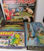 Four board games inc Super Striker, Mine a Million, Payday and Railroader.
