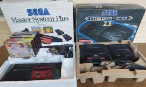 A Sega Mega-CD II in box with controller,