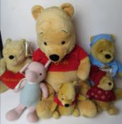 Six Winnie the Pooh Disney cuddly toys.