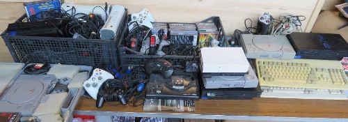 A quantity of video game equipment and consoles inc XBox 360, PS1, PS2, Commodore, Sega Mega Drive,