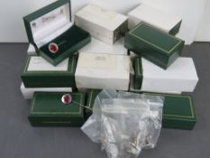 A quantity of boxed lapel pins by Wilkin