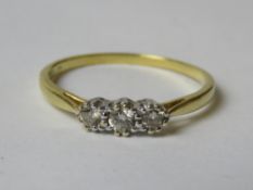 An 18ct gold and diamond trilogy ring,