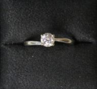 A 0.53ct solitaire diamond ring with GSI certificate, the natural round brilliant diamond set in