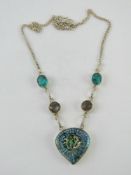 A blue foiled glass necklace, stamped 92