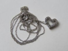 A 14ct white gold heart shaped pendant on 14ct white gold chain, pendant 8mm wide.
