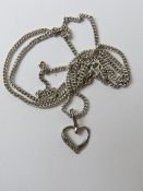 A 9ct white gold and diamond heart shaped pendant on silver chain, pendant 1.5cm in length.