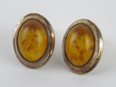 A pair of Baltic amber stud earrings eac