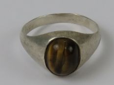 A silver tigers eye cabachon ring, stamp