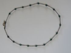 A Native American style green stone and