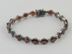 A hallmarked silver garnet coloured ston