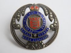 A sterling silver enamel and marcasite R