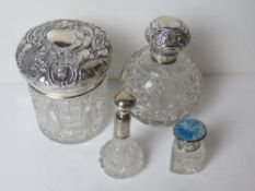 A HM silver and cut glass perfume bottle with matching powder pot.
