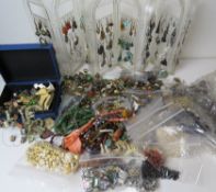 A quantity of assorted vintage costume jewellery including a large number of single earrings,