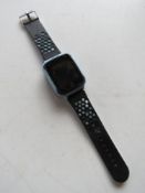 An unknown brand smart watch on blue and black rubberised strap. Untested.