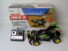 A Nikko Venus III radio controlled car in original box with controller. Untested.