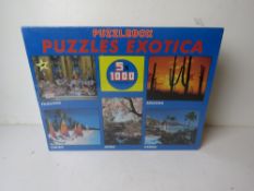 A Puzzle Exotica puzzle box having five 1000 piece puzzles, in original plastic.