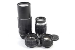 Four Asahi Pentax M42 mount camera lenses. To include a 50mm 1:1.