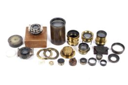 A collection of antique and brass lenses and lens parts