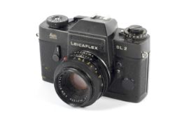 A black Leica Leicaflex SL2 35mm SLR camera. With 50mm 1:2 Summicron R lens.
