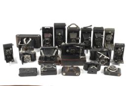 A collection of antique folding cameras.