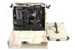 A Victar 16mm Cine Projector with a Dallmeyer Max-Lite lens within a travel case.