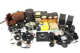 An assortment of cameras and related accessories.