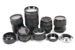 Six Minolta and Minolta fit lenses and two adaptors. Lenses include a 55mm 1:1.