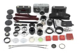 A collection of Leitz Leica accessories.