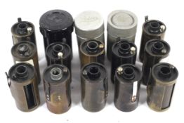 A collection of reloadable 35mm film cartridges. Seven marked Leitz and five unmarked.