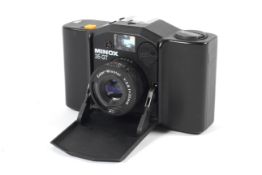 A Minox 35 GT 35mm camera. With a 35mm 1:2.