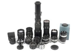 A collection of M42 mount camera lenses. To include a Pentacon 29mm 1:2.8, a Prakticar 135mm 1:2.