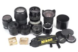 A collection of Nikon and Nikon fit lenses and accessories. To include a 21-35mm 1:3.5-4.