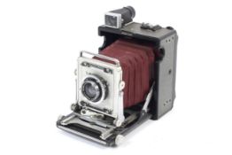 A Graflex Century Graphic 2x3 baby press camera. With red bellows and a 105mm 1:5.