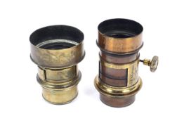 Two brass antique lenses. The first marked Darlot Paris, the second marked A Rofs London.