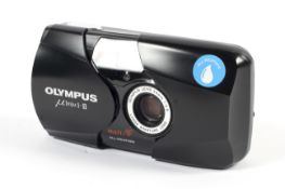 An Olympus MJU II 35mm point and shoot camera. With a 35mm 1:2.