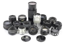 A collection of M42 mount camera lenses. To include a Soligor 28mm 1:2.8, a Pentacon 50mm 1:1.