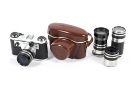 A Corfield Periflex 3a 35mm camera together with four lenses. To include a Retro-Lumax 35mm 1:3.