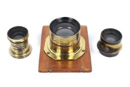 Three brass antique lenses.