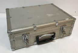 An aluminum case containing ten various lenses including a Tamron Adaptall 2 zoom lock lens,