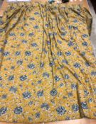 A single cotton twill mustard and blue foliate decorated interlined curtain with fixed triple