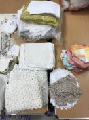 Three boxes of assorted household linen to include tablecloths, napkins, pillow cases,