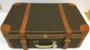 A vintage Louis Vuitton suitcase with later alterations