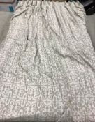 A pair of linen weave green and beige C scrolling blackout interlined curtains with pleated velvet