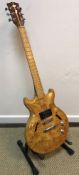 A burr maple bodied cut away guitar unnamed