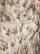 A pair of cotton type gold ground floral decorated lined curtains with fixed triple pencil pleat