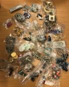 A box containing assorted vintage buttons, belts, belt buckles,