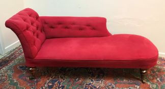 A Victorian buttoned upholstered scroll