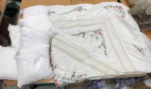 A box containing six white crochet cover